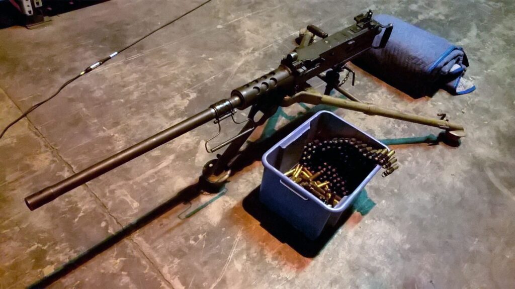 Machine gun tripod with ammo and mat—perfect reference for designing weapon sounds from a firearms sound effects library on Sonniss.
