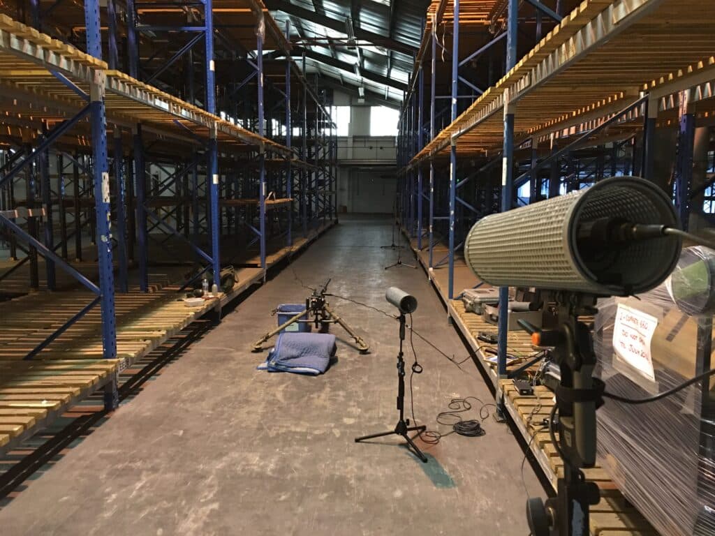 A professional sound effects library setup with microphones in a warehouse—ideal for recording gunshot sfx at Sonniss.