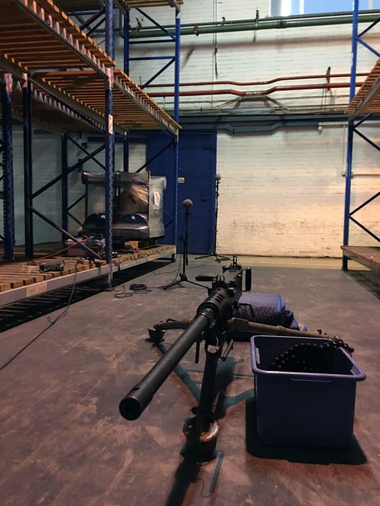 The image is of a sound effects library on Sonniss featuring real machine gun SFX from a London warehouse with metal shelving.