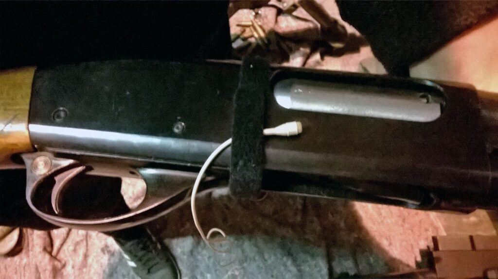 Close-up of a firearm wired for recording—ideal for reference in your gunfire sound effects library on Sonniss.