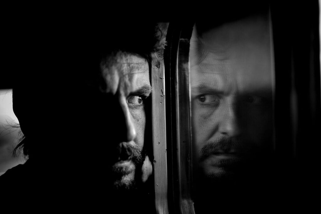 A bearded man gazes out, evoking the emotional depth found in a cinematic sound effects library on Sonniss.