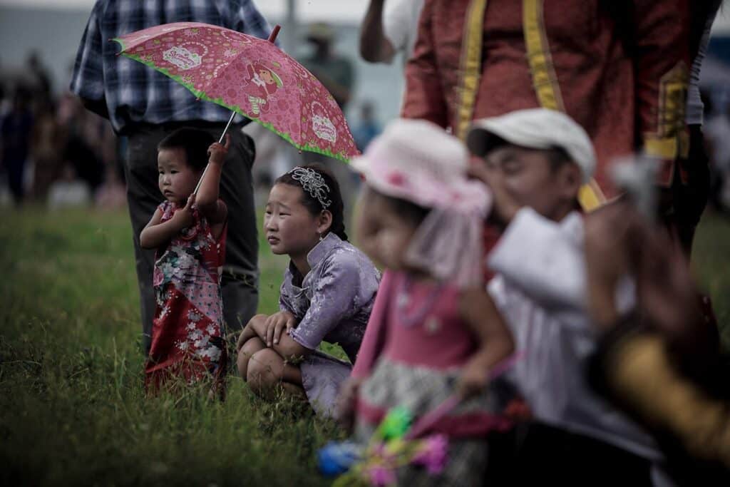 This image of a sound effects library on Sonniss shows children with umbrellas at a lively outdoor event—ideal for festival SFX.