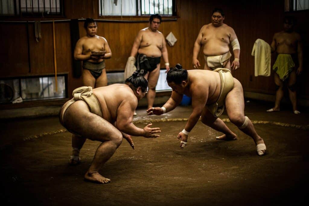 Sumo wrestlers spar in a training ring—an authentic scene ideal for worldwide ambience sound effects libraries on Sonniss.