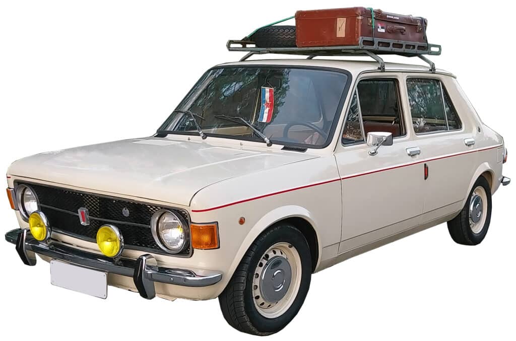 A vintage beige car sound library: perfect for recording driving sound effects, roof rack loaded with suitcases, Serbian flag window.