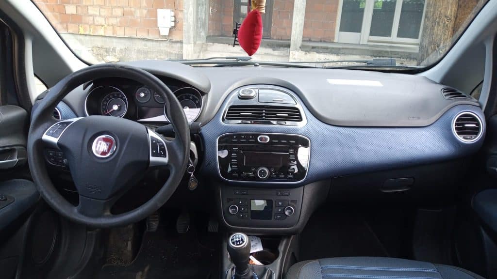 The interior of a car, showing the steering wheel.