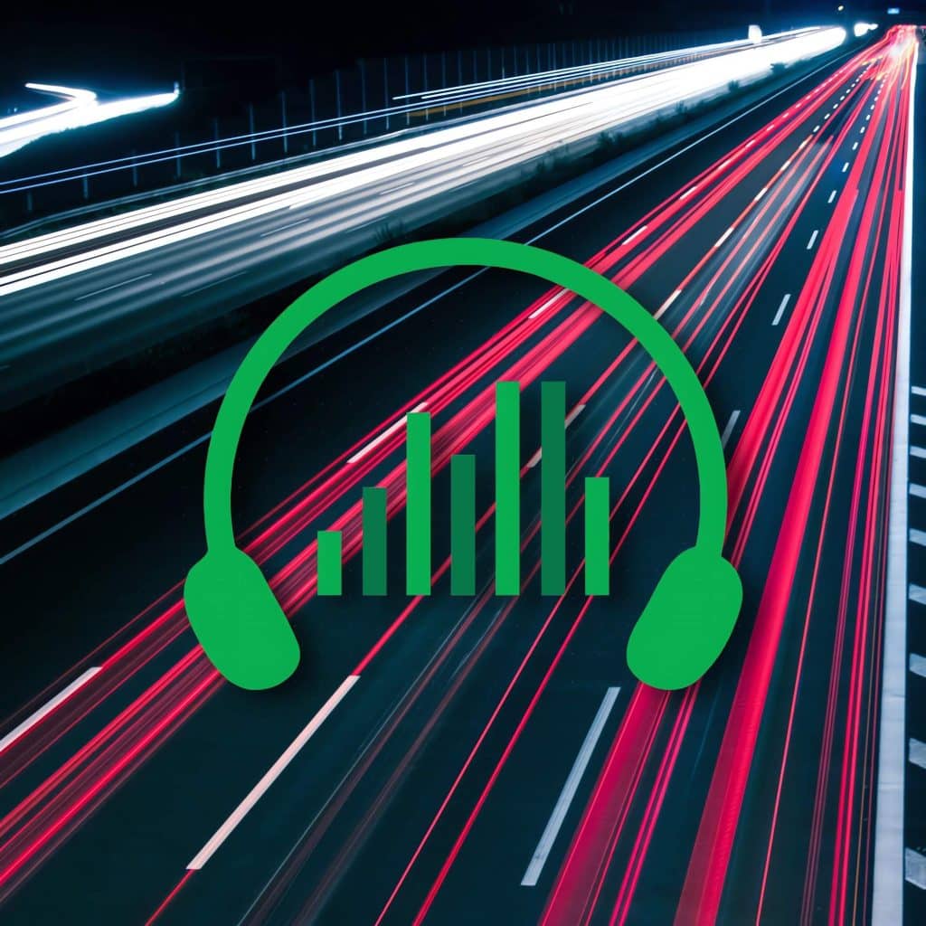 An image of headphones on a highway at night.