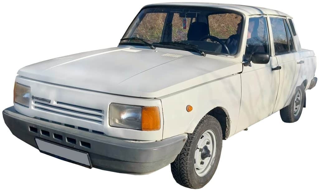 A white four-door sedan from the late 20th century for "car door closing sound effects" in a sound effects library on Sonniss.