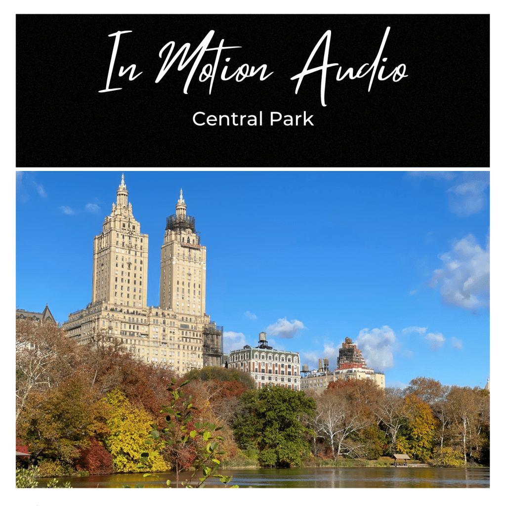 Central Park in autumn with colorful trees and a lake in the foreground; historic buildings under a blue sky. Text: “In Motion Audio Central Park.”.