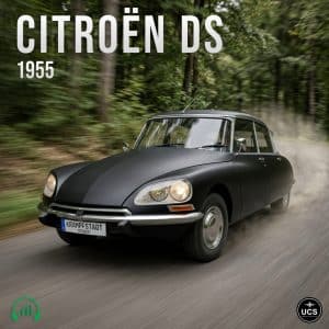 A black 1955 Citroën DS driving quickly down a tree-lined road, dust behind it. "CITROËN DS 1955" text at top, two logos below.