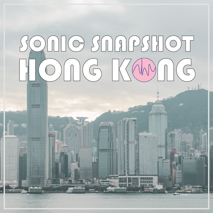 Hong Kong skyline with tall buildings, green hills in the background, cloudy sky. “SONIC SNAPSHOT HONG KONG” text overlays image.