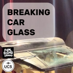Damaged car roof with shattered glass, set beneath the text “BREAKING CAR GLASS.” Film Sound Library and Universal Category System logos appear in the corner.