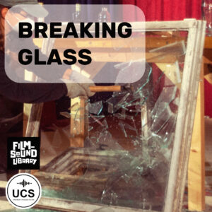 A person wearing gloves uses wooden supports to break a large glass window, sending shards scattering. The text “BREAKING GLASS” appears across the image, with Film Sound Library and UCS logos in the corner.