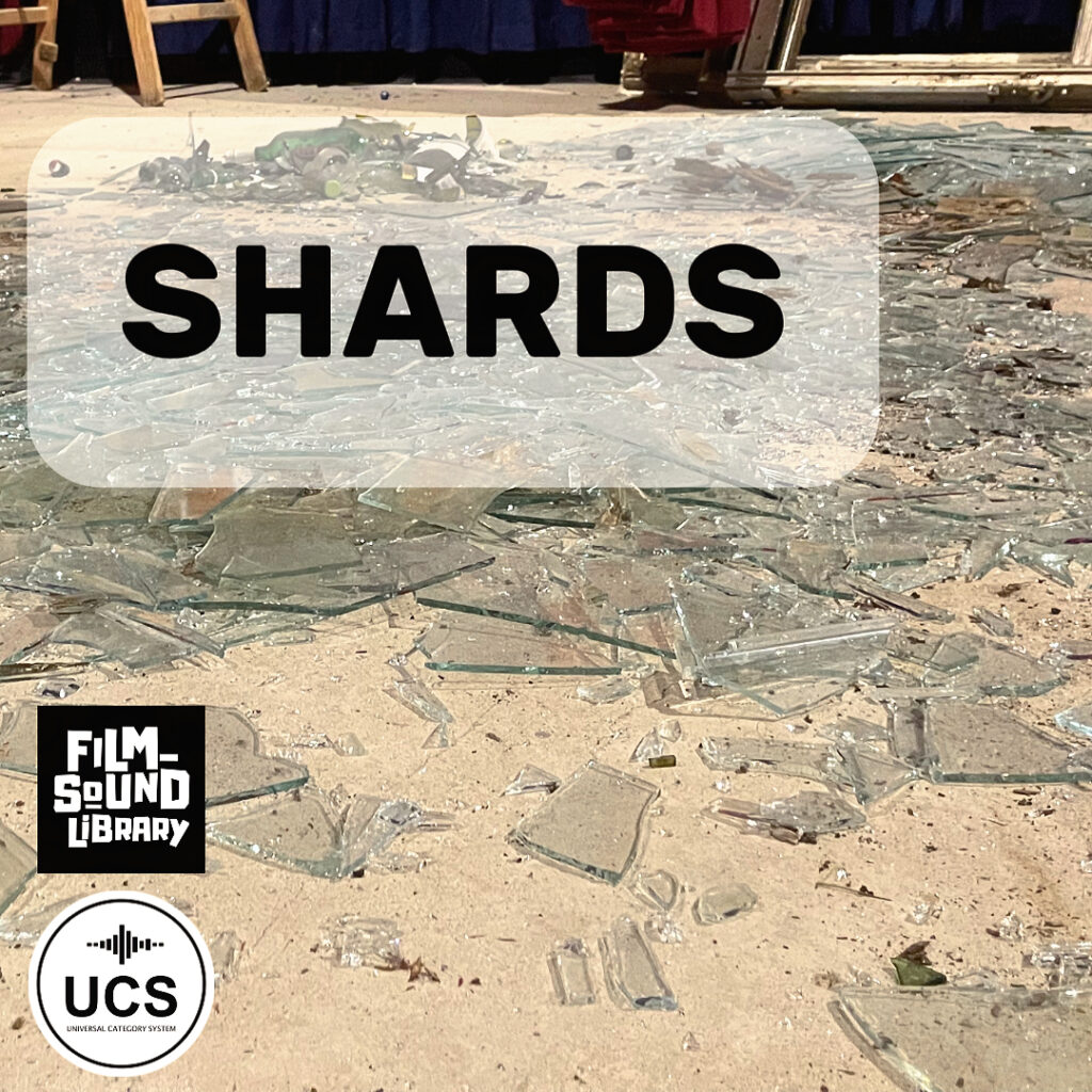 Broken glass shards are spread out on a sandy floor, with the word “SHARDS” in bold letters at the top. The Film Sound Library and UCS logos are displayed in the lower left corner.