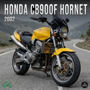 A yellow 2002 Honda CB900F Hornet motorcycle parked on a winding road with hills in the background, angled to show the front and side. Text and logos are visible on the image.