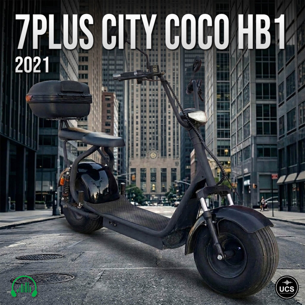 Black 7Plus City Coco HB1 2021 electric scooter motorbike with rear storage box parked on a city street.
