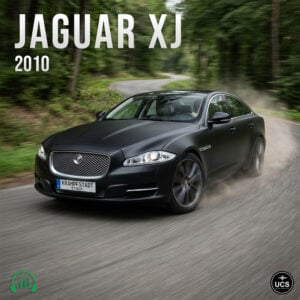 Black 2010 Jaguar XJ full-size saloon drives fast around a forest road bend.