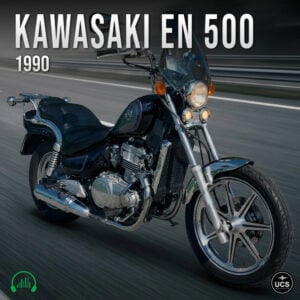 Black 1990 Kawasaki EN 500 cruiser motorcycle moves fast on an asphalt road with a motion blur background.