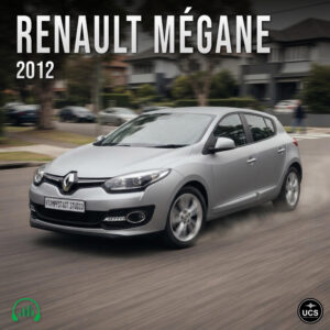 Silver 2012 Renault Megane compact hatchback drives along a suburban road.