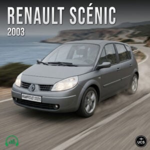 Grey 2003 Renault Scenic compact MPV minivan drives along a winding coastal road.