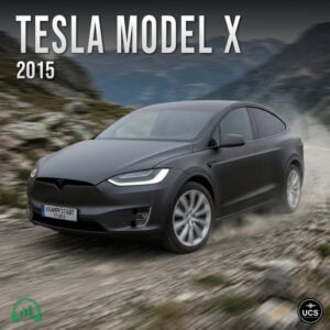 Matte black 2015 Tesla Model X electric full size crossover SUV drives on a dirt mountain road.