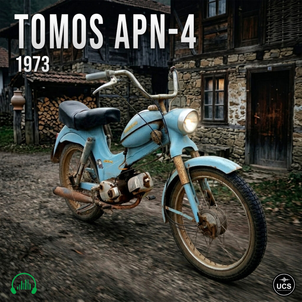 Vintage light blue 1973 Tomos APN-4 moped parked on a dirt path before a rustic wooden building.