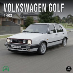 1983 Volkswagen Golf compact hatchback driving on a suburban road.
